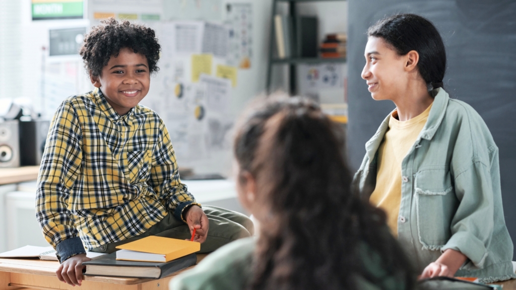 children smiling at each other